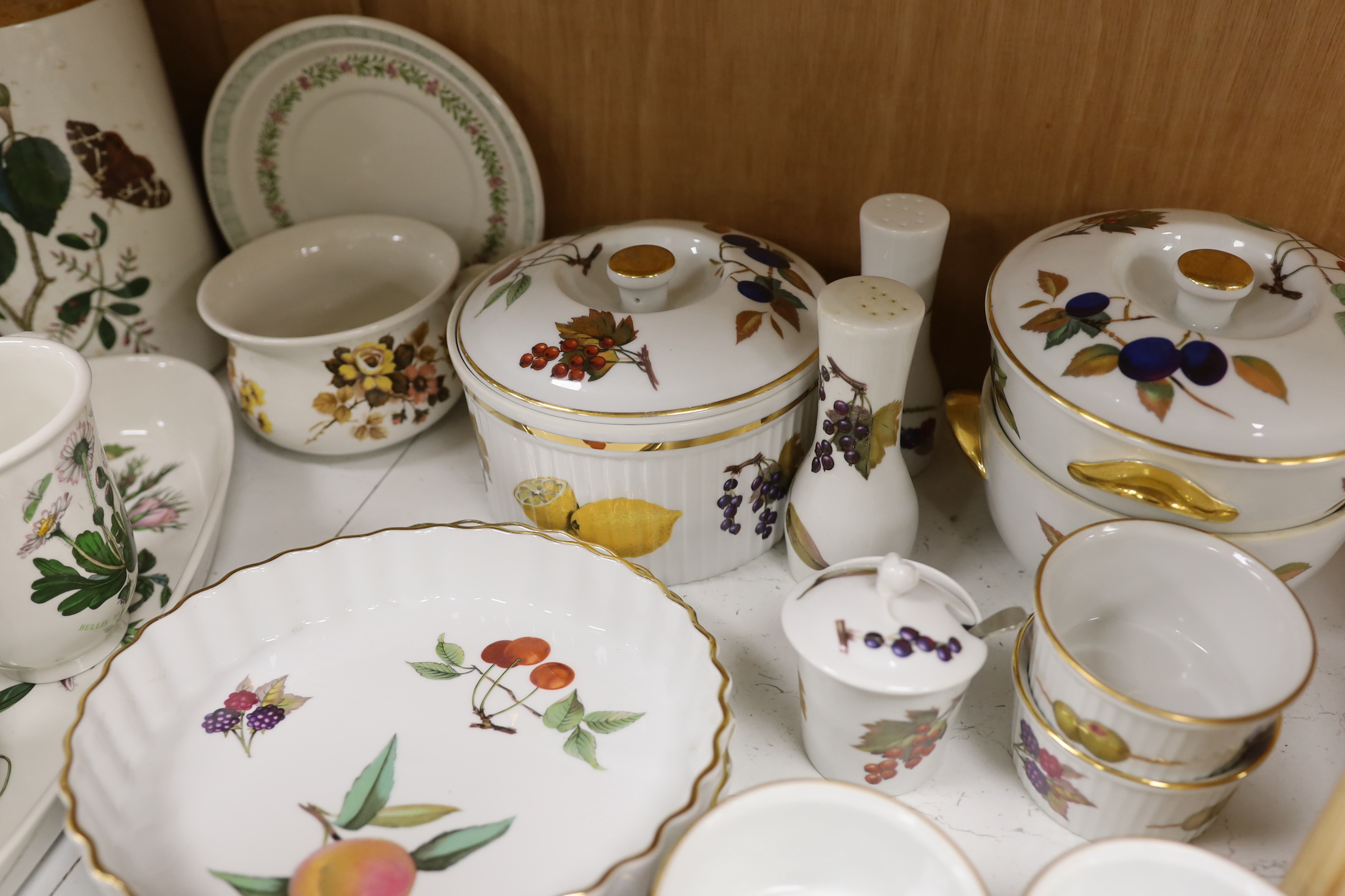 A Royal Worcester Evesham part dinner service, together with Portmeirion items including eight mugs, three lidded tureens, etc.